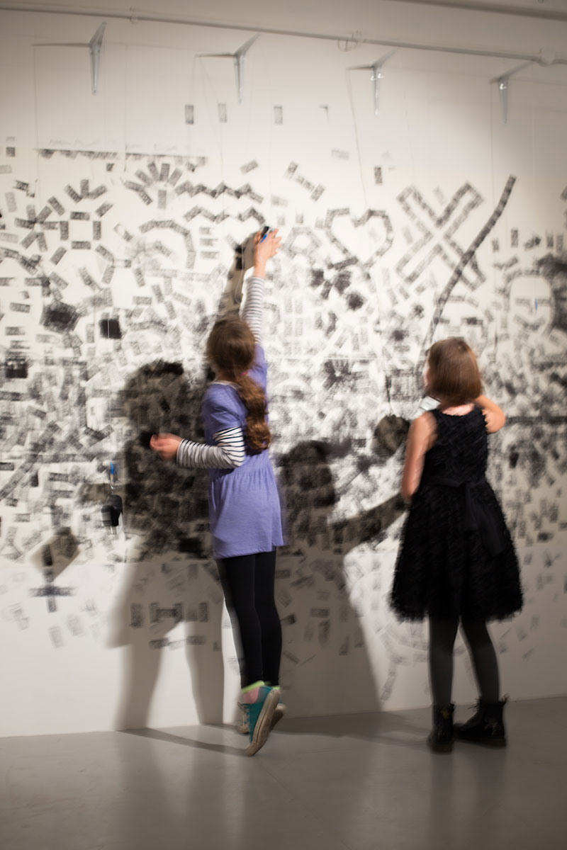 Two girls interacting with the installation.